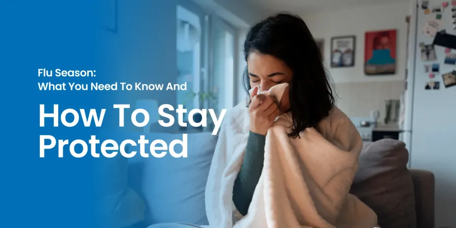 Woman sitting on a couch wrapped in a blanket, sneezing into a tissue during flu season – tips on how to stay protected